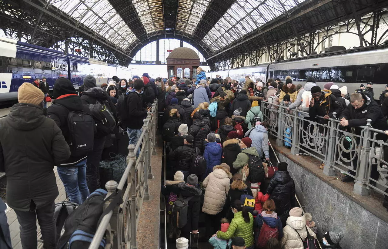 Ukrainian refugees wait for trains in Lviv